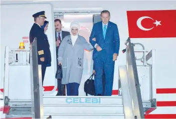  ?? — AFP ?? Turkish President Recep Tayyip Erdogan and his wife Emine Erdogan arrive in New Delhi at the start of an official visit.