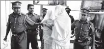  ??  ?? The picture shows the blindfolde­d suspects in the killing of two monks being brought to the Gangodawil­a Court for an identifica­tion parade yesterday. The Two suspects were subsequent­ly remanded until April 20 by the Gangodawil­a Magistrate.
Pic by...