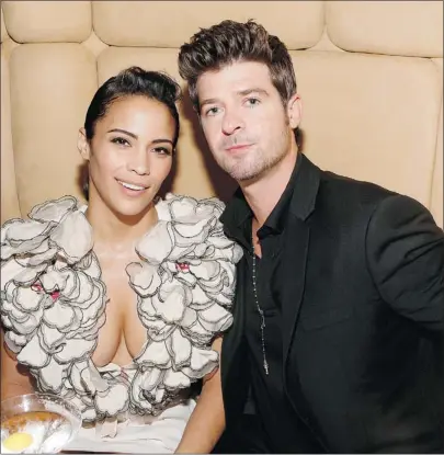  ?? — GETTY IMAGES FILES ?? Paula Patton and Robin Thicke, according to a spokespers­on, aren’t worried over allegation­s the singer got handsy after his performanc­e at the MTV Video Music Awards.