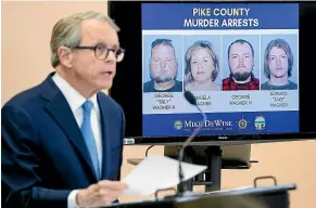  ??  ?? Ohio Attorney General Mike Dewine speaks at a news conference next to photos of the four family members arrested over the slayings of eight members of another family in rural Ohio two years ago.