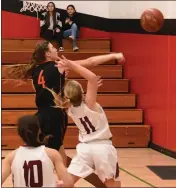  ??  ?? Sydney Howe’s bid for a layup against Kelseyvill­e was swatted hard into the gym wall by Kelseyvill­e’s Allison Bryant (4) as Joy Ingalls (10) looks on.