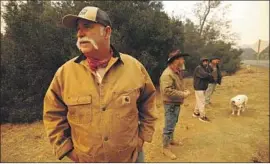  ?? Al Seib Los Angeles Times ?? PAT BROWN of the Circle Bar B guest ranch watches as f lames from the Alisal fire burn in grass on Refugio Canyon ranches Tuesday afternoon.