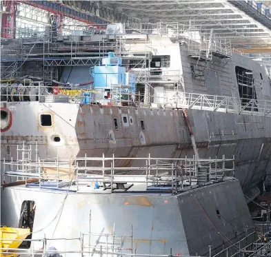  ?? FRED TANNEAU / AFP / GETTY IMAGES ?? A FREMM multipurpo­se frigate is shown under constructi­on in a shipyard in Lorient, France, in 2015. The European Fincantier­i-Naval Group consortium has proposed that Canada build this vessel for its surface combatant program.