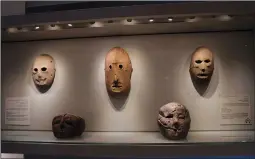  ?? (AP/Maya Alleruzzo) ?? A Neolithic mask (center) loaned by American billionair­e Michael Steinhardt is displayed Jan. 5 at the Israel Museum in Jerusalem.