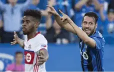  ?? PAUL CHIASSON/THE CANADIAN PRESS ?? TFC’s Raheem Edwards, left, wasn’t happy about a goal by the Impact’s Matteo Mancosu in Montreal Wednesday. The game ended in a 1-1 draw.