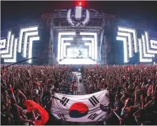  ??  ?? Festival participan­ts dance during the Ultra Korea Music Festival last year.