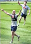  ?? PHOTO: PETER MCINTOSH ?? Celebratio­ns . . . Otago centre Matt Faddes and winger Mitchell Scott (behind) celebrate winning a game during Otago training at Forsyth Barr Stadium yesterday.