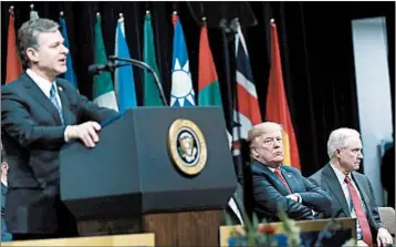  ?? EVAN VUCCI/AP ?? President Donald Trump, listens to FBI Director Christophe­r Wray speak at an FBI Academy graduation ceremony.