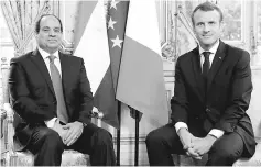  ??  ?? Macron (right) poses for a photograph with al-Sisi at the Elysee Palace, in Paris. — AFP photo