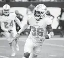  ?? SETH WENIG/AP ?? Dolphins free safety Adrian Colbert defends a play against the New York Jets in 2019.