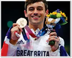  ?? ?? GOLDEN BOY: Tom Daley at the 2020 Tokyo Olympics, above, and, right, appearing on BBC’s Comic Relief programme in March