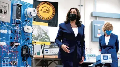  ?? SUSAN WALSH/AP ?? Vice President Kamala Harris tours clean energy laboratori­es at the University of Wisconsin-Milwaukee during a visit last month to promote President Joe Biden’s infrastruc­ture plan. Sen. Tammy Baldwin, D-Wis., is seen with Harris.