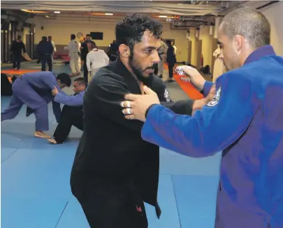  ?? Chris Whiteoak / The National ?? Talib Al Kirbi, left, the only Emirati black belt after Faisal Al Ketbi, is the UAE’s main hope in the 69kg class. He has a firstround bye as the jiu-jitsu competitio­n opens in Jakarta on Friday