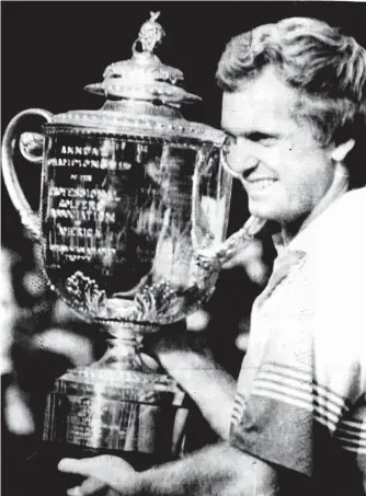  ??  ?? Wayne Grady’s greatest moment as he holds the trophy after his US PGA win in 1990.