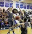  ?? JOHN BLAINE — FOR THE TRENTONIAN ?? Hightstown’s Jevon Sands (31) puts up a shot as he’s surrounded by Old Bridge’s Nick Zaleck (10), Chris Wyer (22) and Julius Belton (3) during a Central Jersey Group IV playoff game on Thursday night.