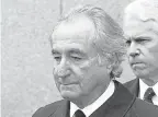  ?? DAVID KARP/ AP ?? Former financier Bernie Madoff leaves federal court in Manhattan in 2009. Madoff, who orchestrat­ed the largest Ponzi scheme in history, died in prison on Wednesday.