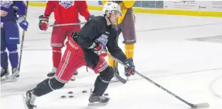  ?? JASON SIMMONDS/THE GUARDIAN ?? Chris McQuaid breaks in on the goal during a recent Summerside Western Capitals’ practice at Eastlink Arena. The Caps open the regular season at home against the Valley Wildcats today at 7 p.m.