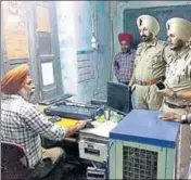  ?? HT PHOTO ?? Police at the power substation from where two men looted ~5 lakh after opening fire near Rajasansi in Amritsar on Monday.