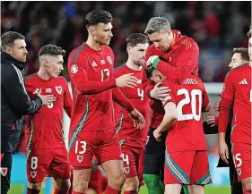  ?? Picture: David Davies/PA ?? Dan James is consoled by his Wales team-mates after his penalty was saved in the shootout against Poland