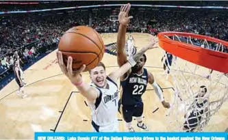  ??  ?? NEW ORLEANS: Luka Doncic #77 of the Dallas Mavericks drives to the basket against the New Orleans Pelicans at the Smoothie King Center in New Orleans, Louisiana. —AFP