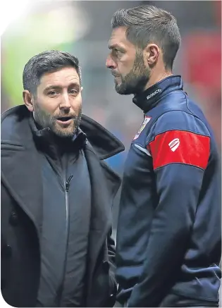  ??  ?? Jamie McAllister (right) in discussion with Bristol City boss, Lee Johnson