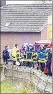  ?? ?? Police and fire department personnel stand by a retirement home after a fire broke out during the night, in BedburgHau in the western German state of North Rhine-Westphali on March 4. Four people died and at least 21 were injured on Monday, German news agency dpa reported. (AP)