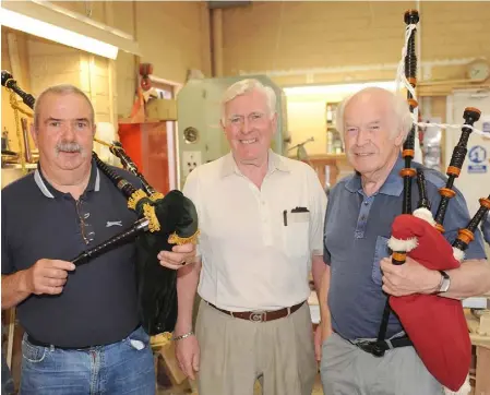  ??  ?? Brian Byrne, with Sean Brown and Owen Hanratty, who played the Bagpipes during the 5th year celebratio­n barbecue at Dundalk Men’s Shed, Seatown.