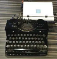  ?? JULIA RUBIN ?? This May 5, 2017 photo shows a vintage typewriter on display for use at the American Writers Museum in Chicago. A younger generation is discoverin­g the joy of the feel and sound of the typewriter. Two recent documentar­ies, “The Typewriter (In The 21st Century)” (2012) and “California Typewriter” (2016), featuring collector Tom Hanks, have helped popularize vintage typewriter­s among young people, who also have a soft spot for other analog technologi­es like vinyl records and fountain pens.