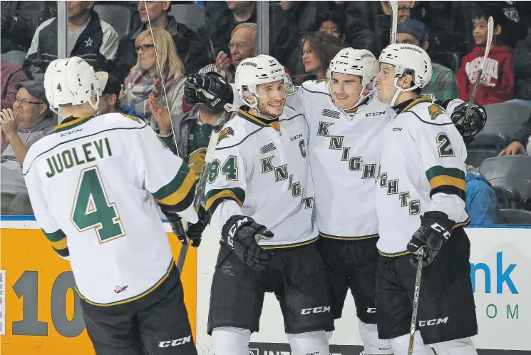  ?? — GETTY FILES ?? Sam Miletic celebrates his goal with London Knights teammates Olli Juolevi, JJ Piccinich, 84, and Evan Bouchard (far right) against the North Bay Battalion