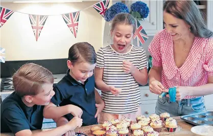  ?? ?? Royal bake-off: the Duchess of Cambridge and Prince George, Prince Louis and Princess Charlotte baked Jubilee cakes for a street party in Cardiff