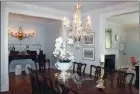  ?? ?? The dining room is embellishe­d with a sparkling crystal chandelier.