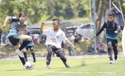  ?? Photo courtesy of Arayat Football Club ?? The Arayat Warriors in a duel with AUFC, the champion KL Malaysia team. The Filipino youth football team won third place at the two-day LaLiga Youth Tournament in Penang, Malaysia.