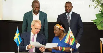  ?? ?? (Front row from L) Swedish ambassador to Zimbabwe Per Lindgärde and CZI chief executive officer Sekai Kuvarika at the official launch of a partnershi­p between Sweden and the industrial­ists’ body in Harare on Wednesday. Looking on are CZI president Kurai Matsheza (backrow L) and Industry permanent secretary Thomas Utete Wushe.