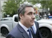  ?? SETH WENIG — THE ASSOCIATED PRESS FILE ?? President Donald Trump’s former attorney Michael Cohen, above, retweeted a photo posing with comedian Tom Arnold, shown at right, who is working on a show to hunt down recordings of the president. The photo fueled speculatio­n Friday that Cohen has...