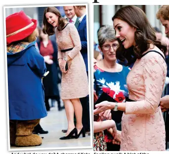  ??  ?? And what do you do? A charmed Kate meets Paddington Bear yesterday Feeling swell: A hint of the duchess’s baby bump is on show