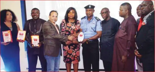  ??  ?? Publisher, National Crime Watch Awards, Tony Okpe (third left) flanked by a cross section of the awardees
