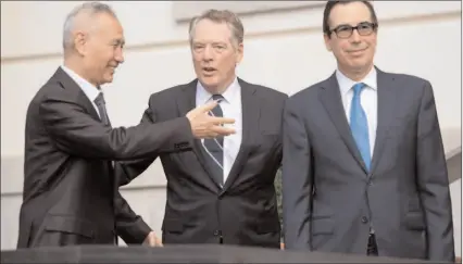  ?? -AP ?? US Treasury Secretary Steven Mnuchin, right, and US Trade Representa­tive Robert Lighthizer, center, greet China's Vice-Premier Liu He in Washington.