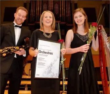  ??  ?? Piper Mark Redmond, conductor Emily Redmond and harpist Eilís Lavelle with the award.