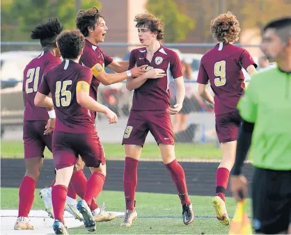  ?? KYLE TELECHAN/POST-TRIBUNE PHOTOS ?? Chesterton’s Gage Kruper, center, celebrates with teammates after scoring a goal against Valparaiso in the first round of the Class 3A Chesterton Sectional on Tuesday.