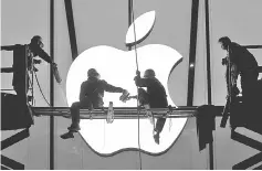  ??  ?? Workers prepare for the opening of an Apple store in Hangzhou, Zhejiang province, China. — Reuters photo