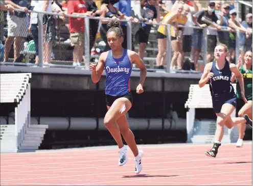  ?? Gregory Vasil / For Hearst Connecticu­t Media ?? Alanna Smith of Danbury wins the 200-meter run during the State Open Track and Field Championsh­ip in June at Willow Brook Park in New Britain. Smith recently qualified for Nationals in the 300 and 55 during the indoor track and field season.