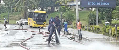  ?? Photo: Waisea Nasokia ?? National Fire Authority officers and Nadi town council workers clean up Nadi town on April 3, 2018.