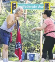  ??  ?? Alan Keck (left) debates Grant Park resident Katie Kurumada about the petition to change the name of Confederat­e Avenue earlier this year.