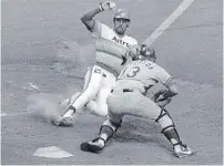  ?? THE ASSOCIATED PRESS FILE PHOTO ?? In this July 1978 photo, Houston Astros first baseman Bob Watson slides into home as Los Angeles Dodgers catcher Joe Ferguson moves in for the tag. Watson is dead at the age of 74.