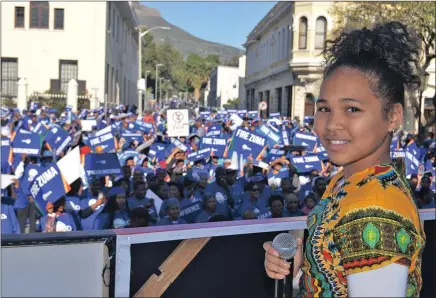  ?? PICTURE: CHRIS SAMUELS ?? Talitha Luiters prepares to sing outside Parliament ahead of the vote on the motion of no confidence in President Jacob Zuma.