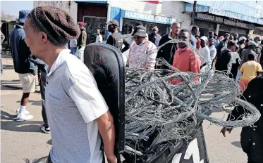  ?? | TIMOTHY BERNARD African News Agency (ANA) ?? CABLES apparently being stolen at Walter Sisulu Square.