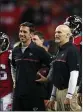  ?? JOHN BAZEMORE — AP ?? Former Falcons offensive coordinato­r Kyle Shanahan, left, speaks with head coach Dan Quinn before their NFC divisional playoff game against the Seahawks on Jan. 14, 2017, in Atlanta.