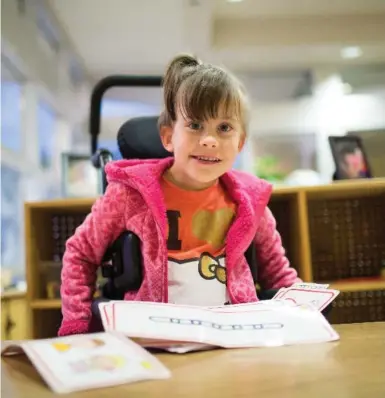  ?? NICK KOZAK FOR THE TORONTO STAR ?? Five-year-old Faith Ellis, who has cerebral palsy, enjoys a variety of programmin­g at her local Y in Oshawa. Faith and her late twin sister, Joy, who also had cerebral palsy, started in the Y’s child-care program when they were 2 1⁄2 years old.