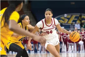  ?? (AP photo/Mic Smith) ?? Arkansas’ Chrissy Carr (34) drives the ball up the court Thursday against Missouri’s Katlyn Gilbert (10) in the first half of an NCAA college basketball game during the Southeaste­rn Conference women’s tournament in Greenville, S.C.