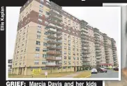  ??  ?? GRIEF: Marcia Davis and her kids with a photo of her mom, Ethel Davis, who they say should have been left in her fireproof Queens apartment.